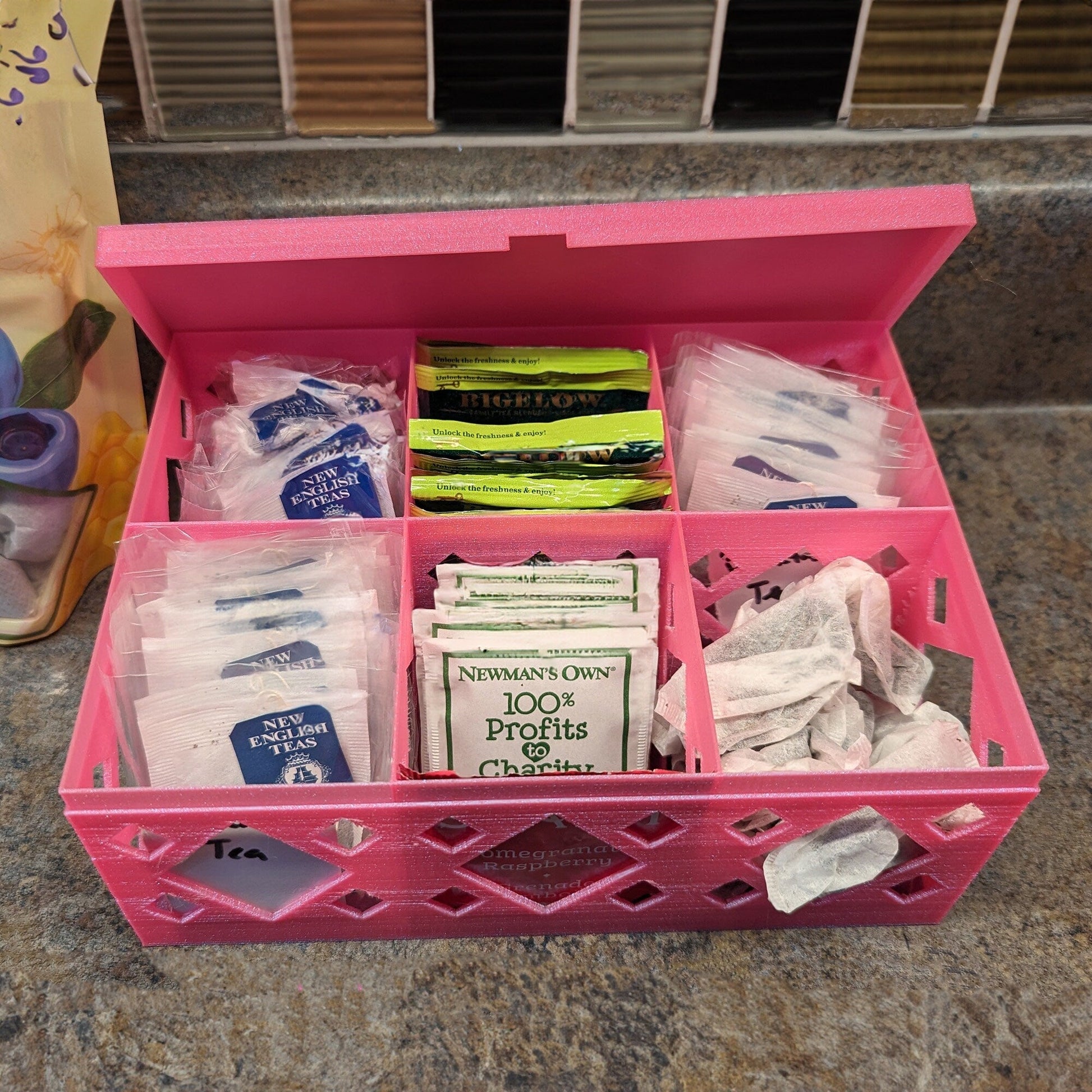 a pink box filled with lots of different items