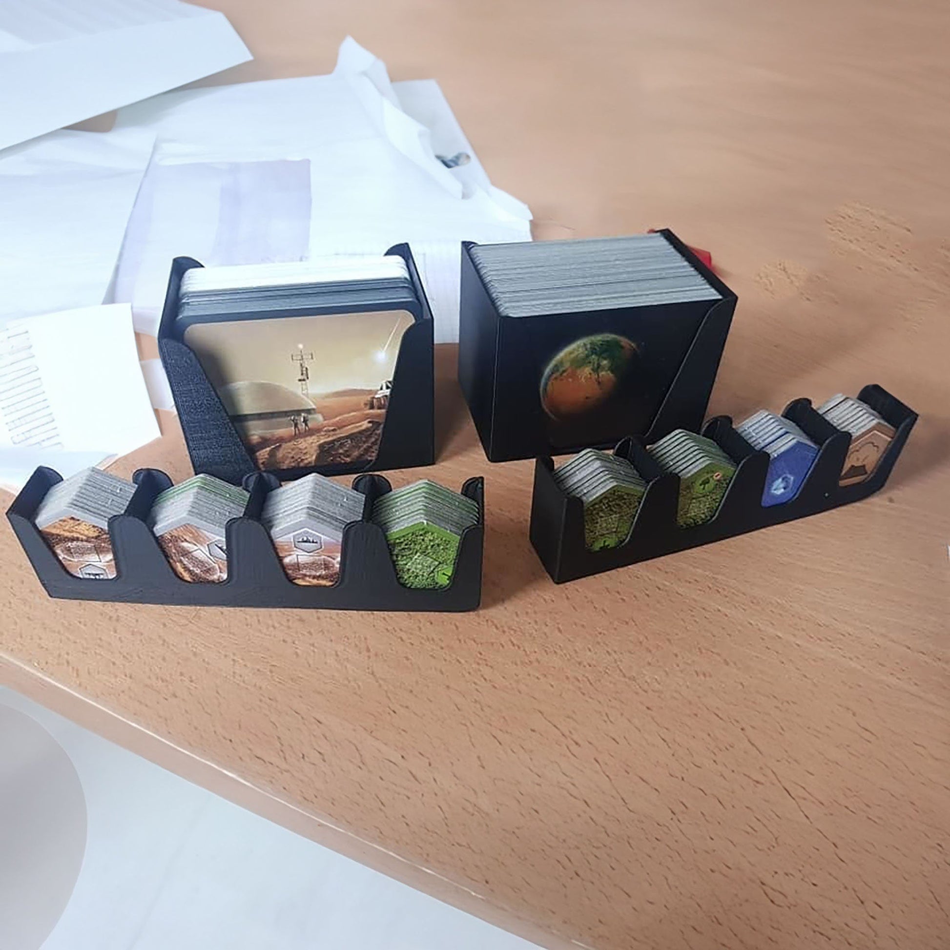 a couple of boxes sitting on top of a wooden table