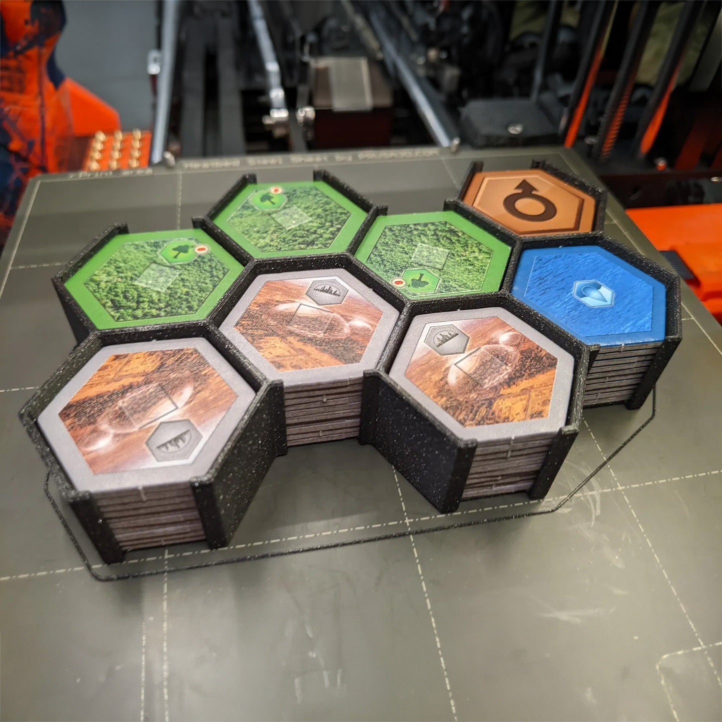 a bunch of different colored hexagonals on a table