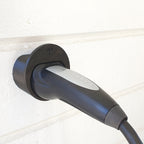 Wall mounted Type 2 EV plug holder with the charging cable looped over the top, view 2