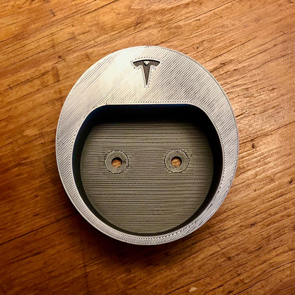 Wall mounted Type 2 EV plug holder with the charging cable looped over the top, view 4