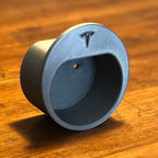 Wall mounted Type 2 EV plug holder with the charging cable looped over the top