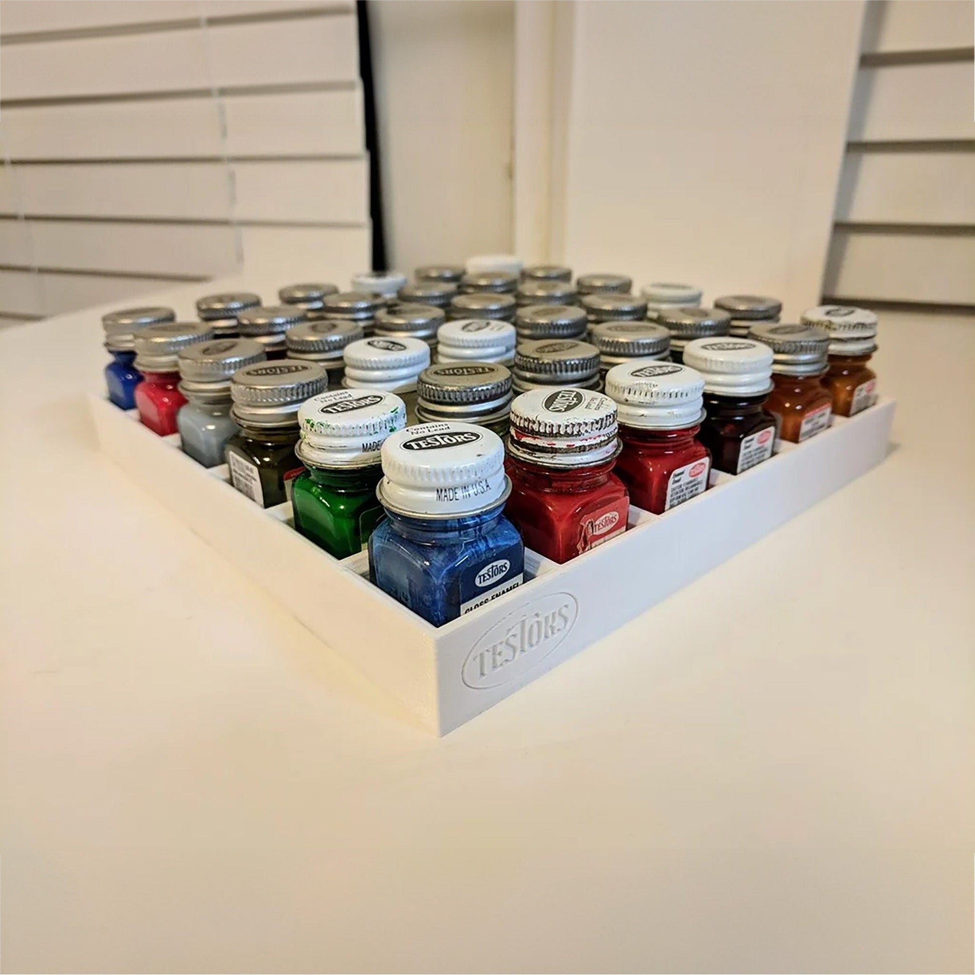 a display of jars of different colors on a table