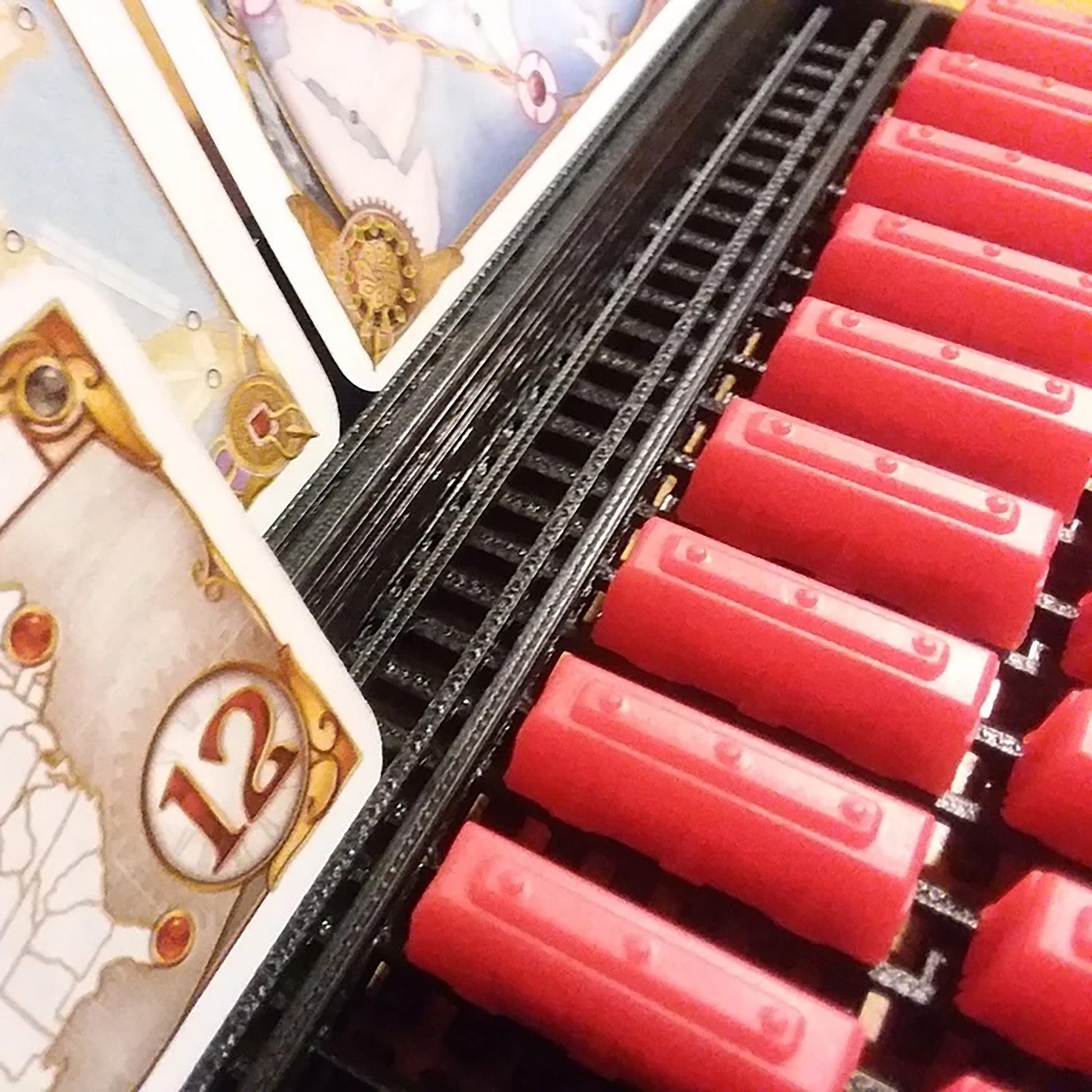 a bunch of red lipstick sitting on top of a shelf