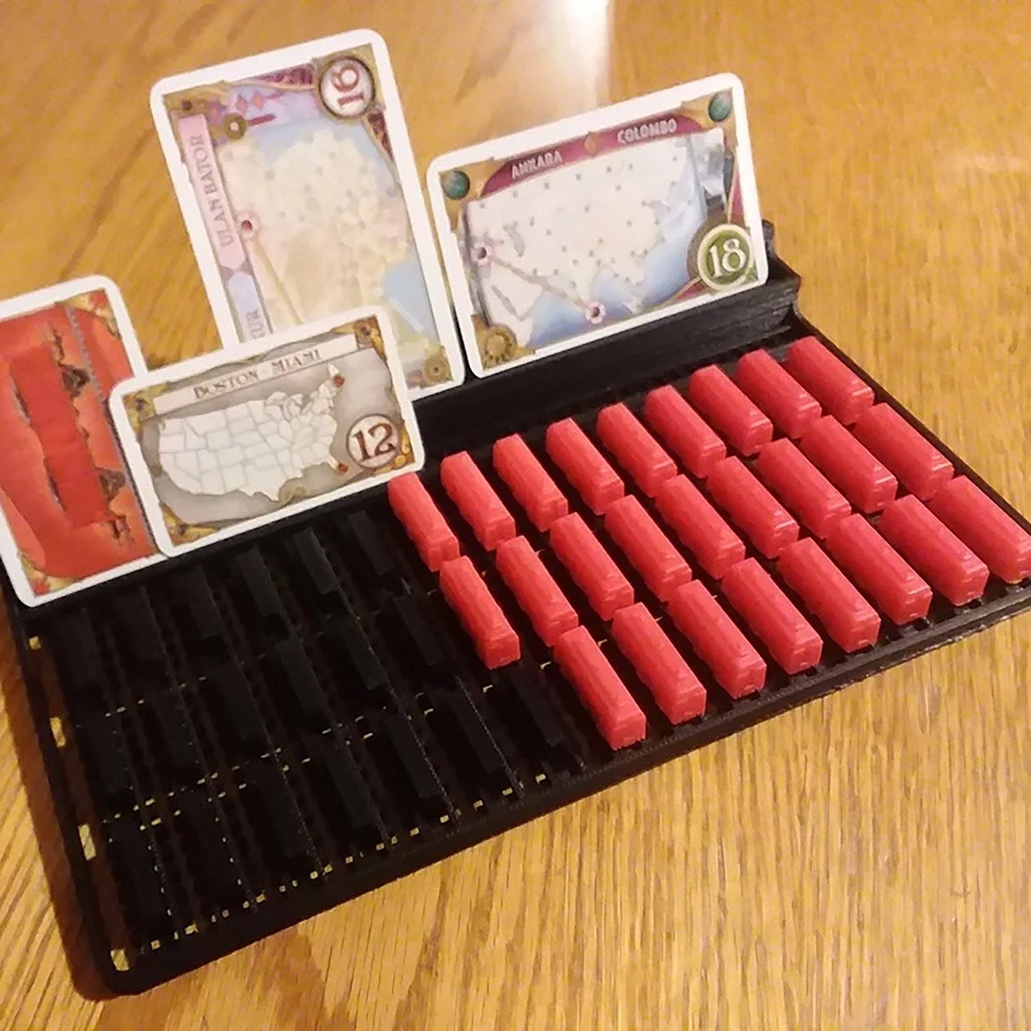 a wooden table topped with lots of red candles