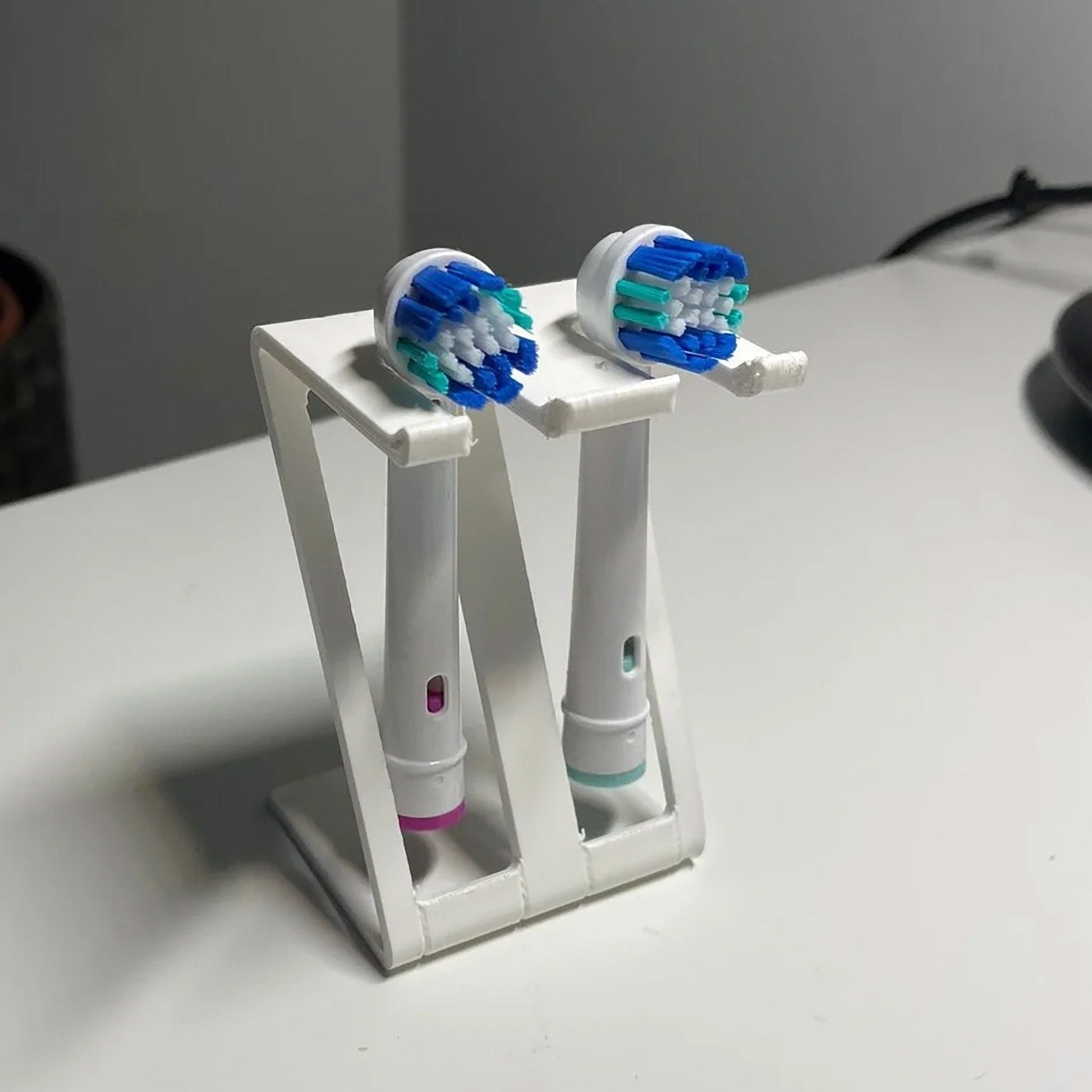 a couple of toothbrushes that are in a holder