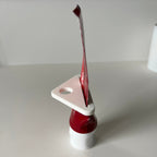 Toothpaste tube squeezer key rolling up a tube from the flat end, view 3