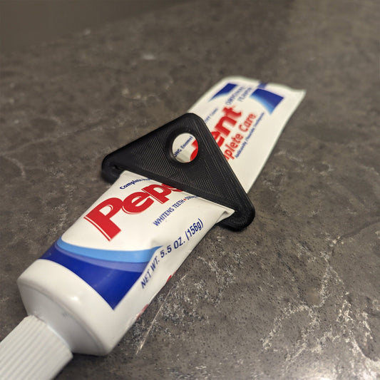 a tube of toothpaste sitting on top of a counter