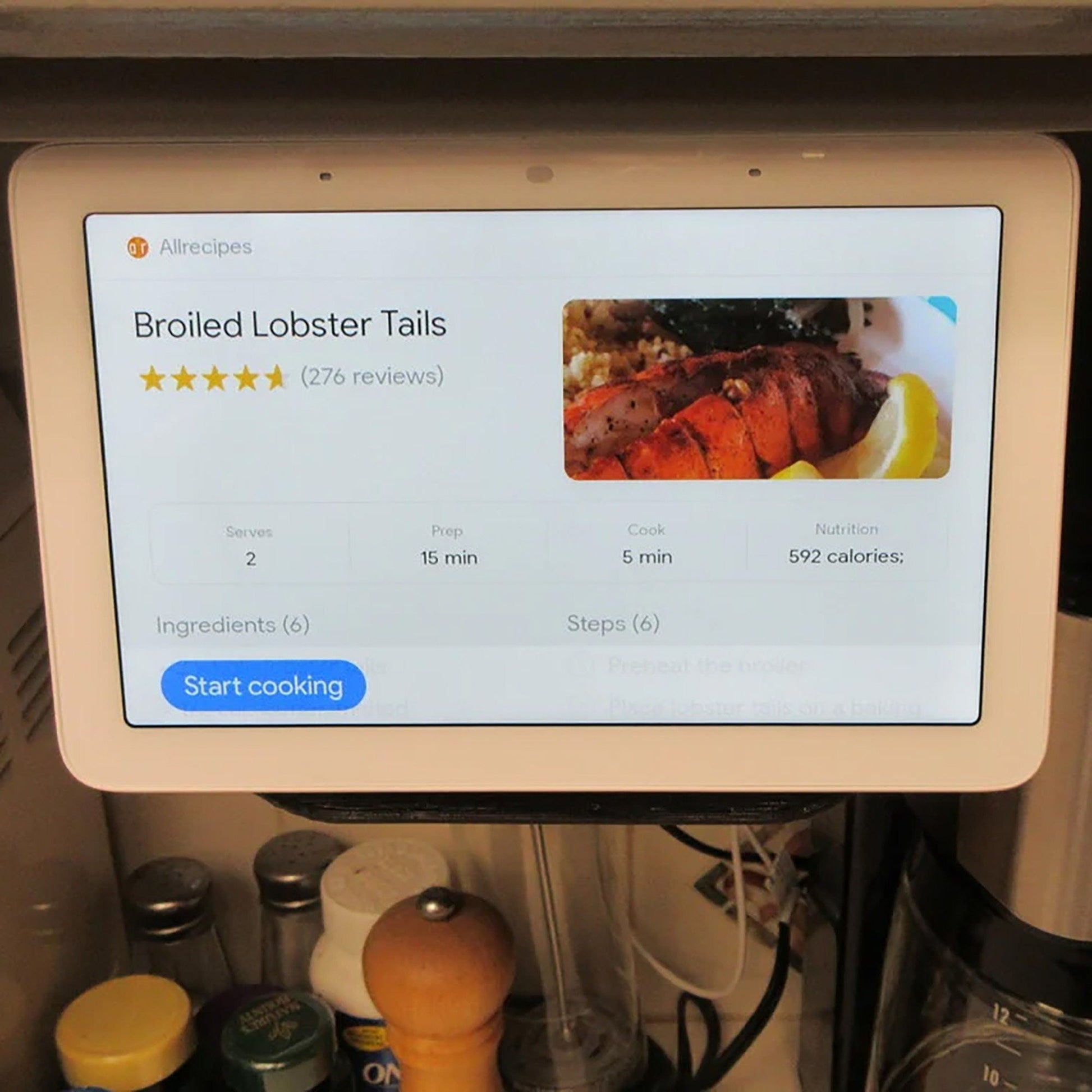 a computer screen displaying a recipe on a kitchen counter