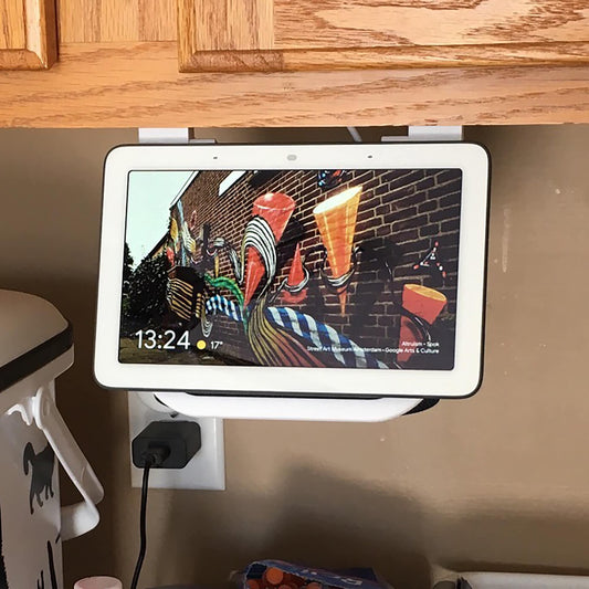 a tablet mounted to a wall in a kitchen