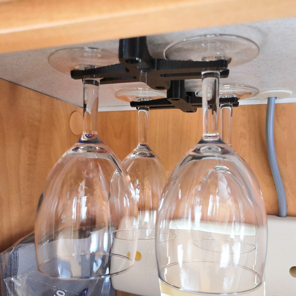 Under cabinet wine glass rack holding stemware upside down