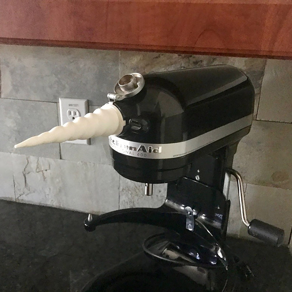 Spiral unicorn horn cover on the front hub of a KitchenAid stand mixer, view 4