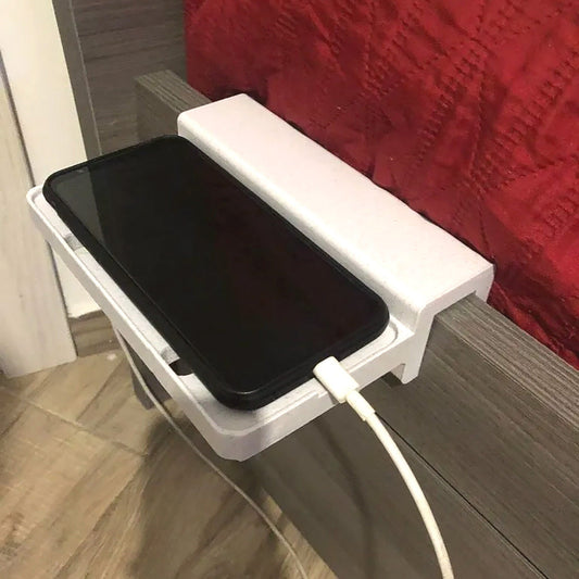 a cell phone is plugged into a charging station