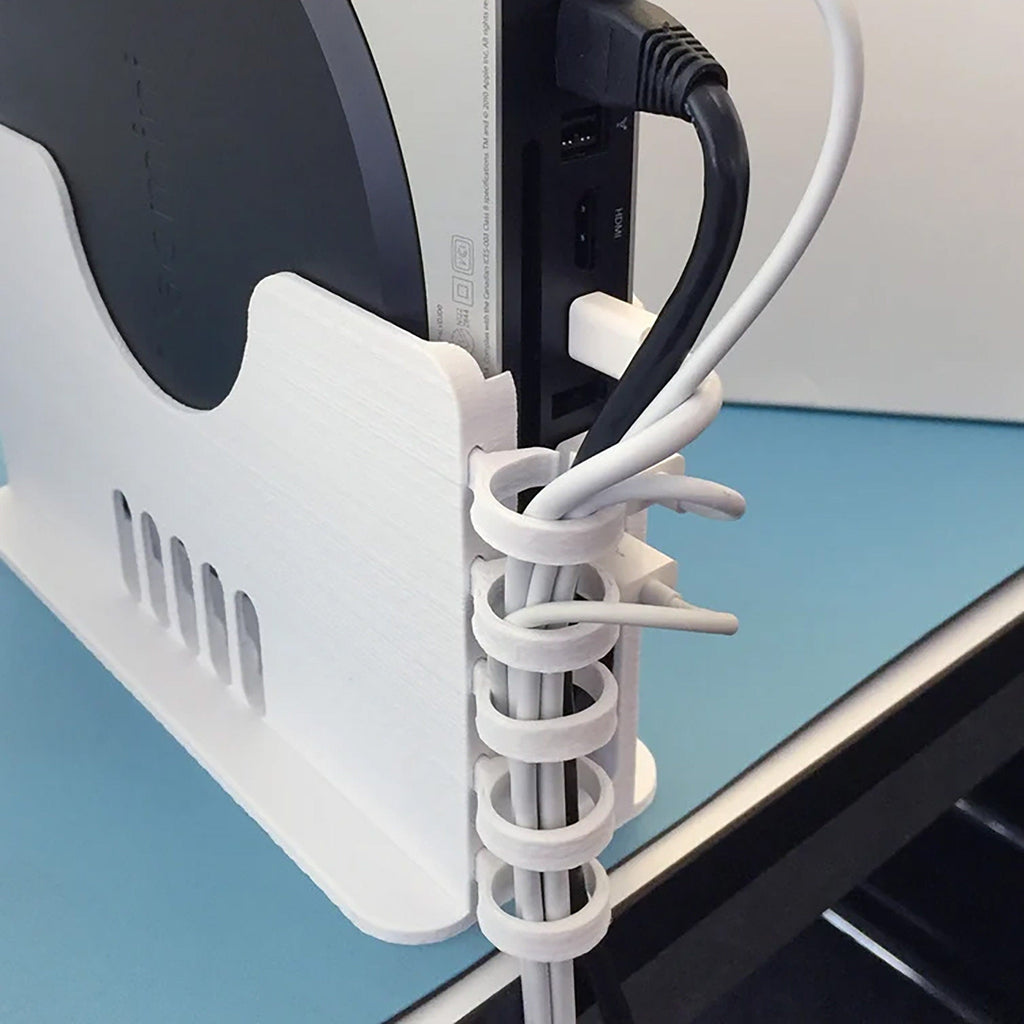 Multi-bay vertical rack holding several Apple Mac Mini units on edge, view 5