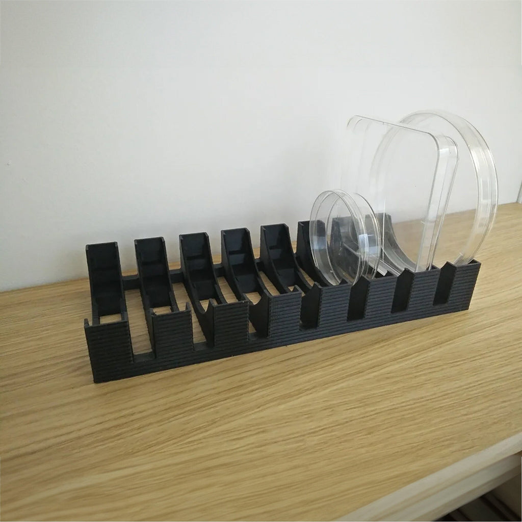 Vertical petri dish rack holding round and square dishes on edge