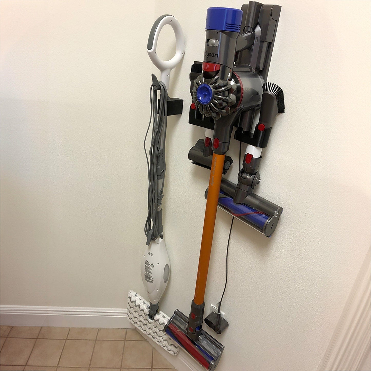 a couple of tools are hanging on a wall