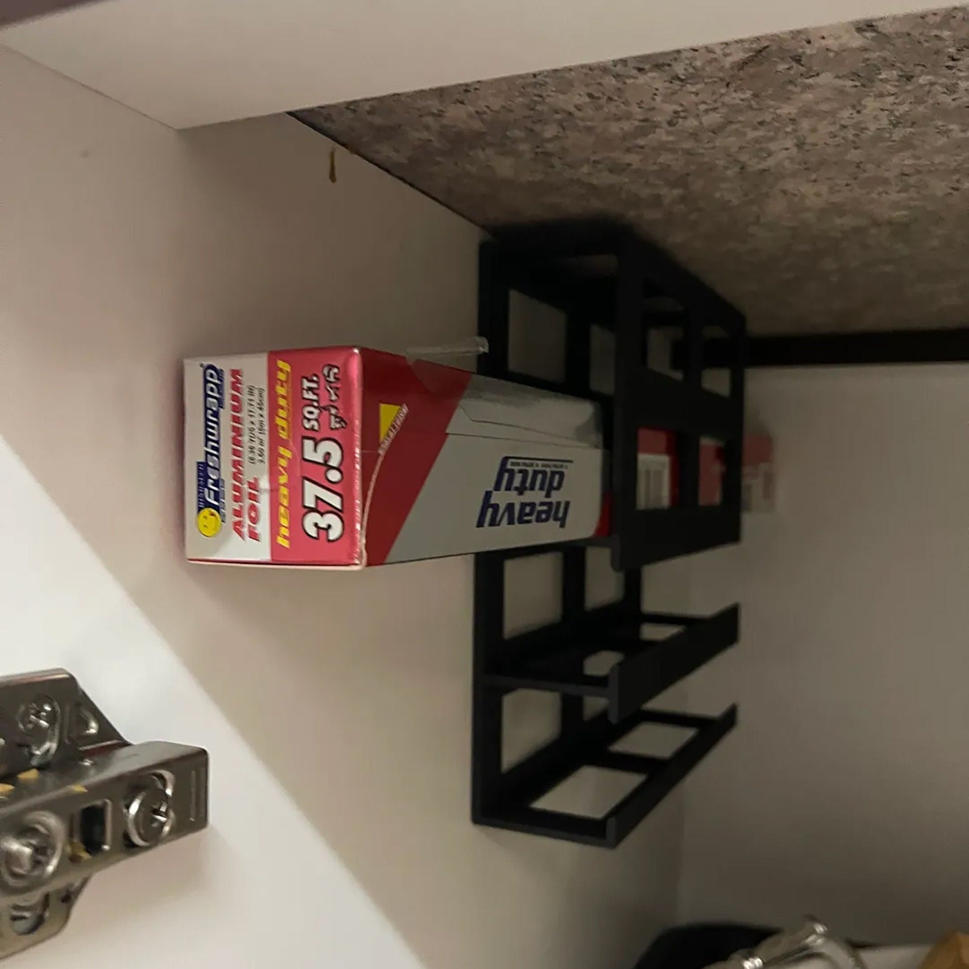 a tube of toothpaste is hanging on a wall