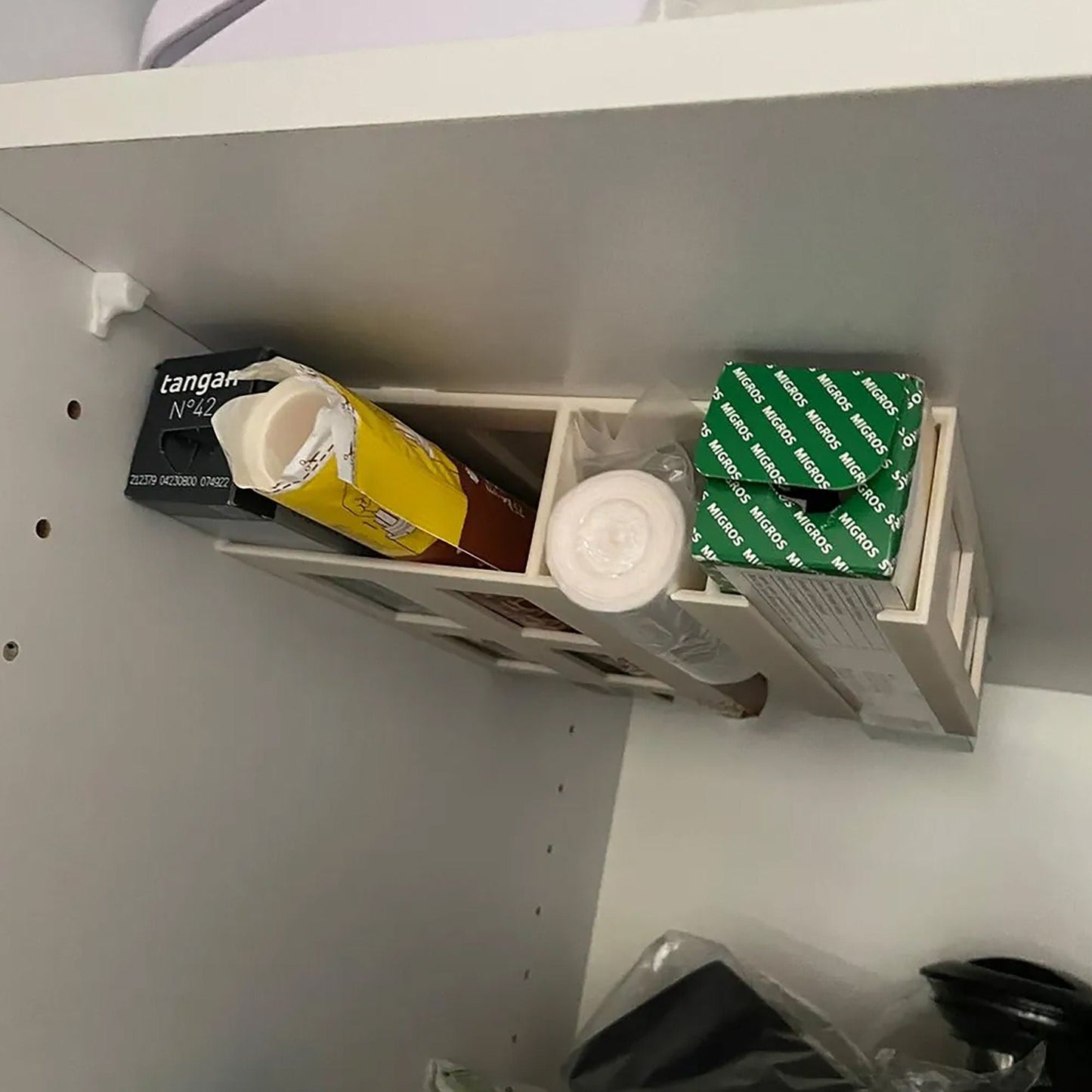 a shelf filled with boxes and boxes of coffee