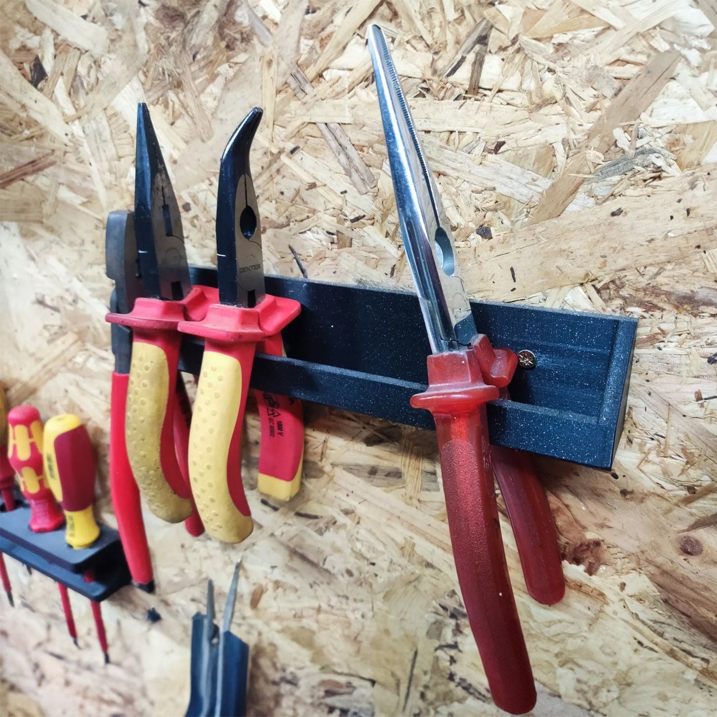 a bunch of tools hanging on a wall