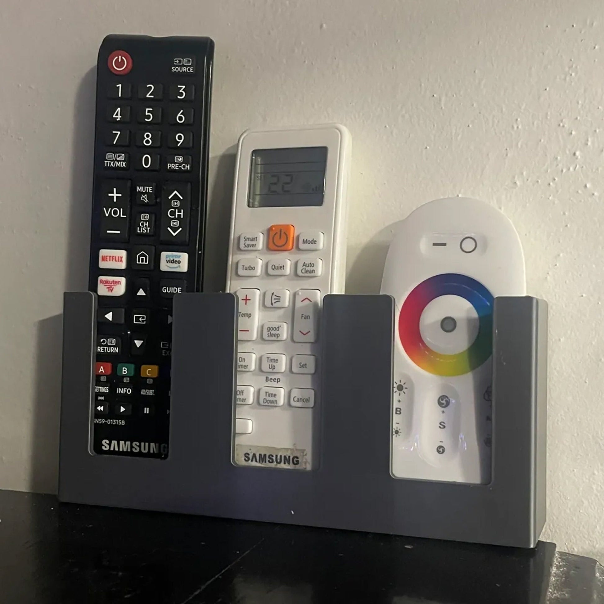 a couple of remote controls sitting on top of a table