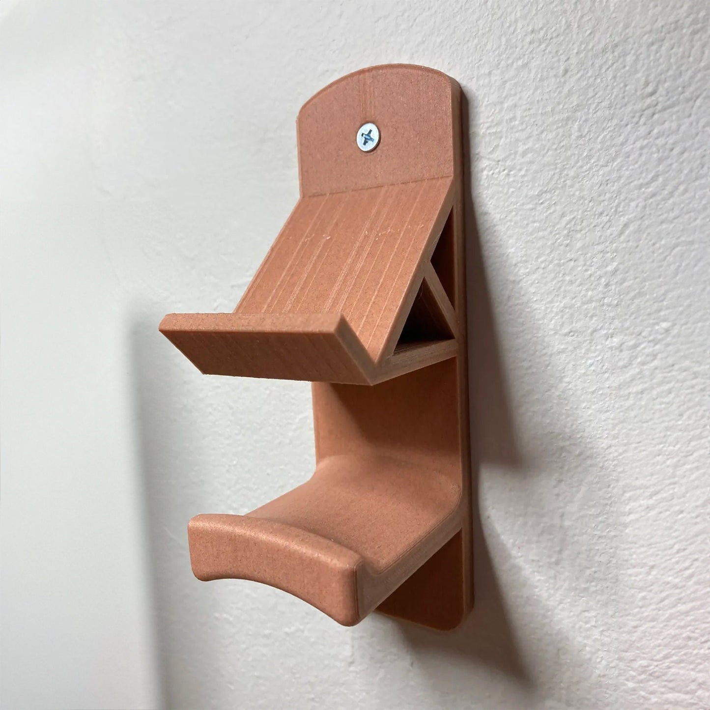 a wooden shelf mounted to the side of a wall