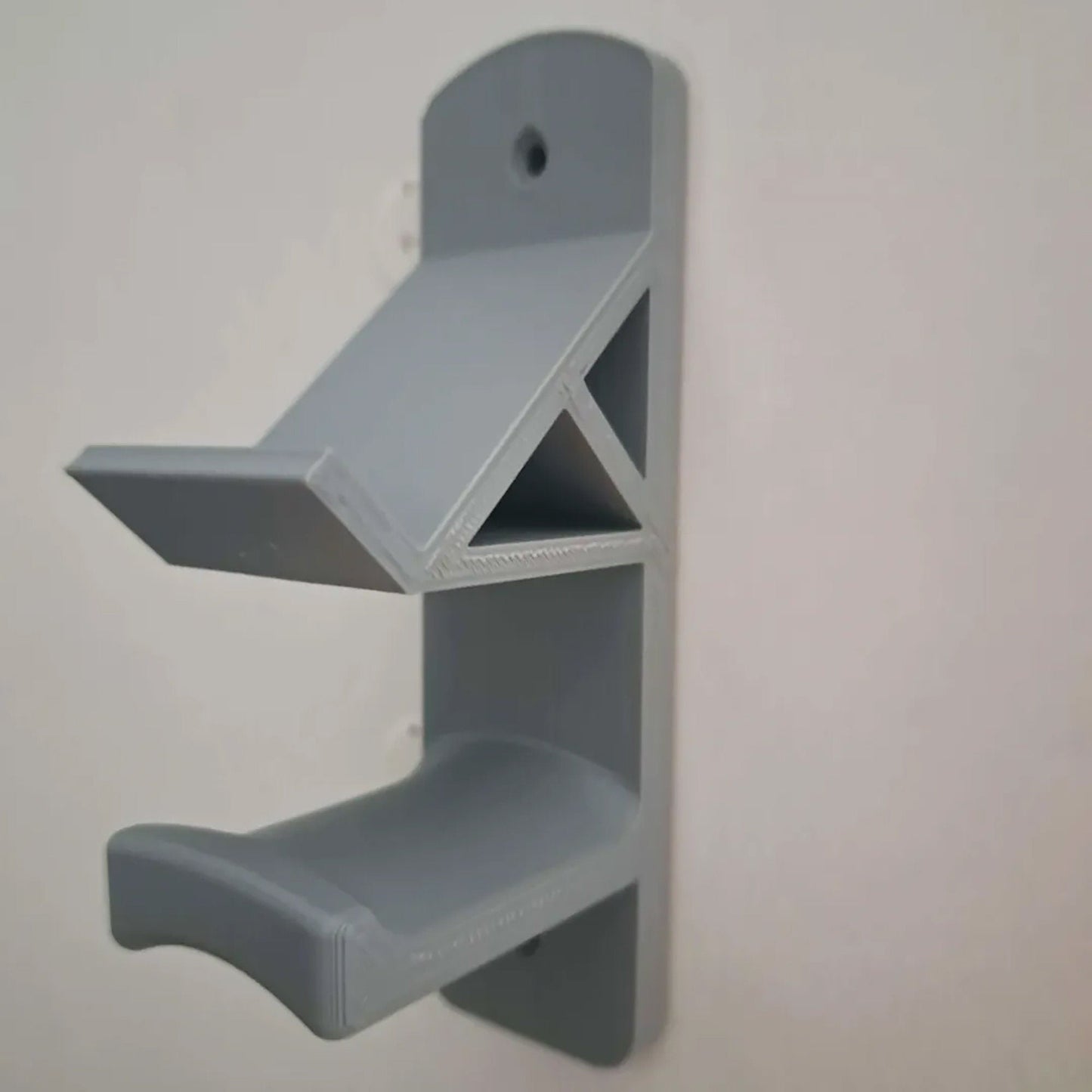 a wall mounted shelf with a shelf attached to it