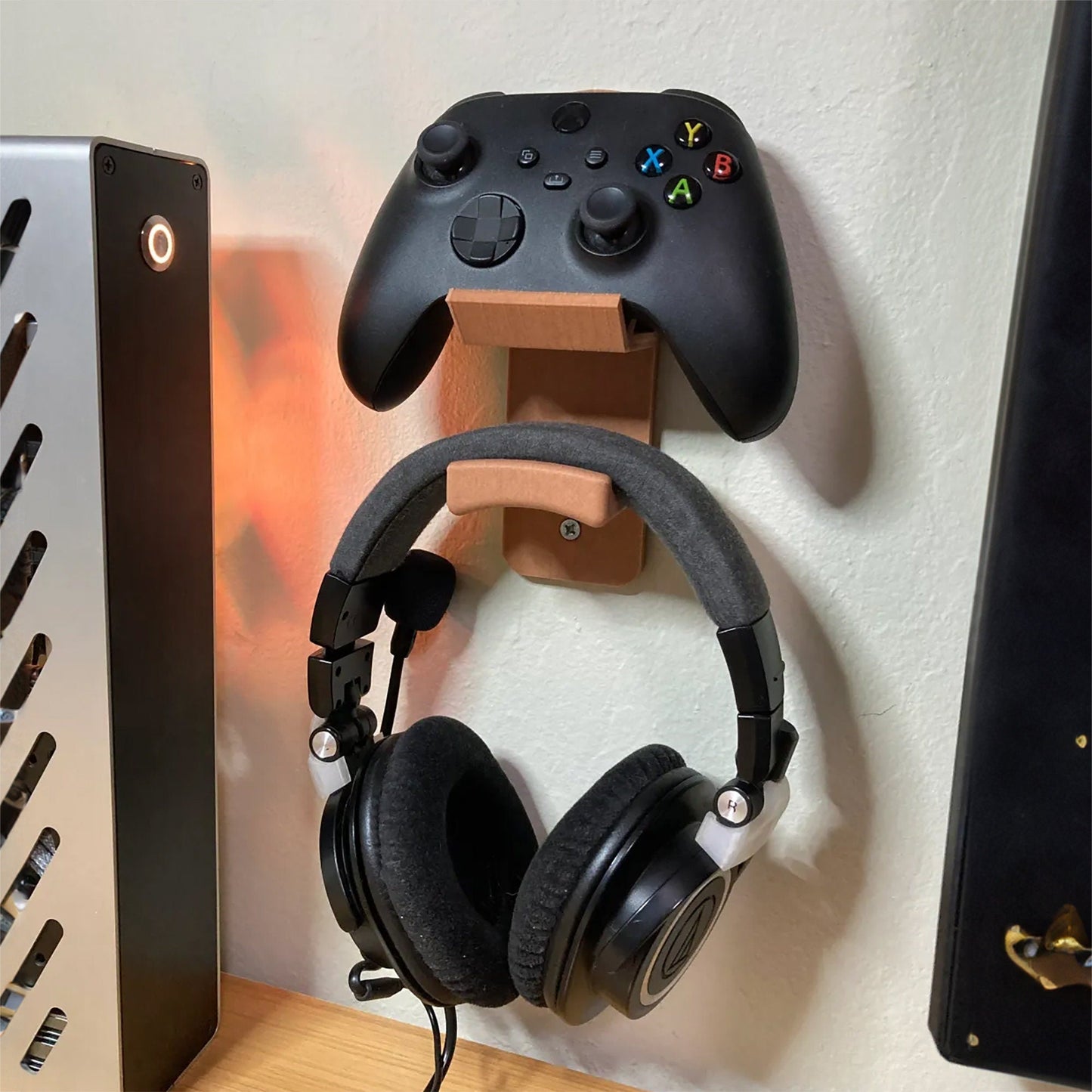 a video game controller mounted to a wall