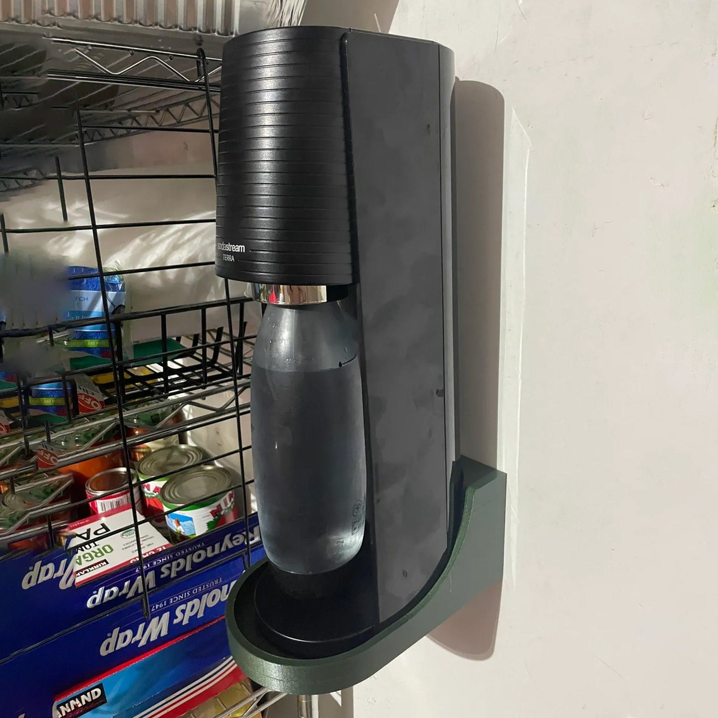 a wall mounted air freshener dispenser on a wall