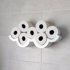 Cloud-shaped wall shelf holding spare toilet paper rolls upright in two rows