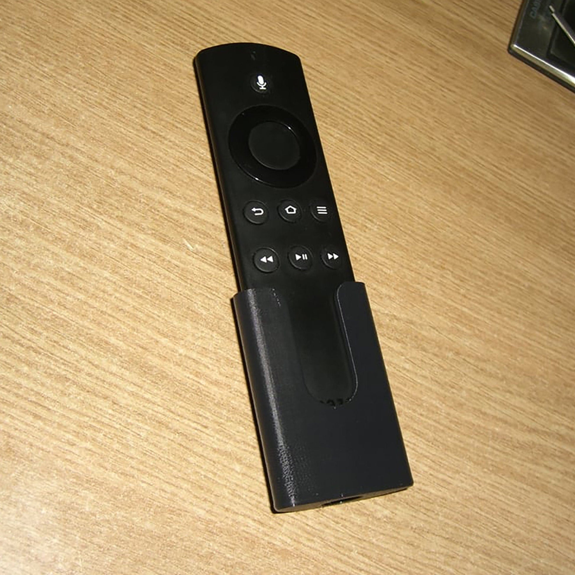 a close up of a remote control on a table