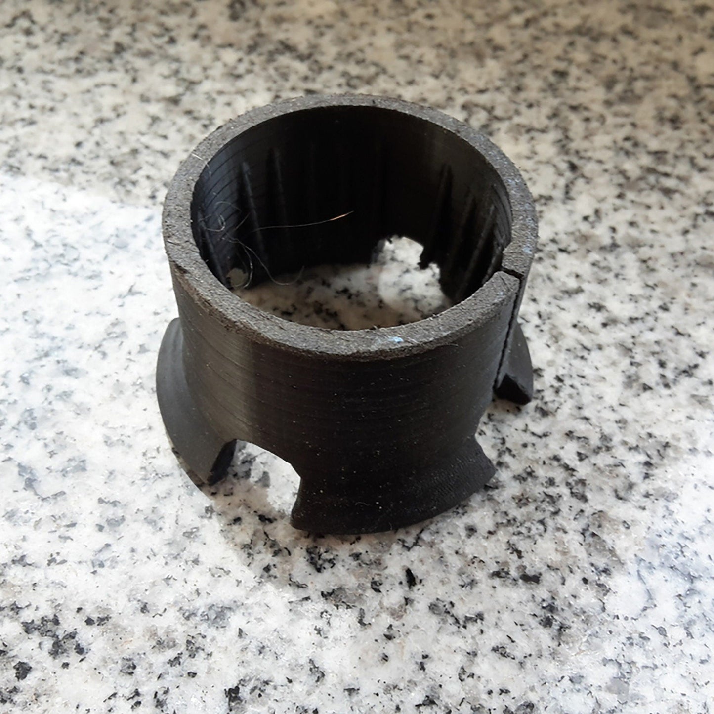 a black object sitting on top of a white counter